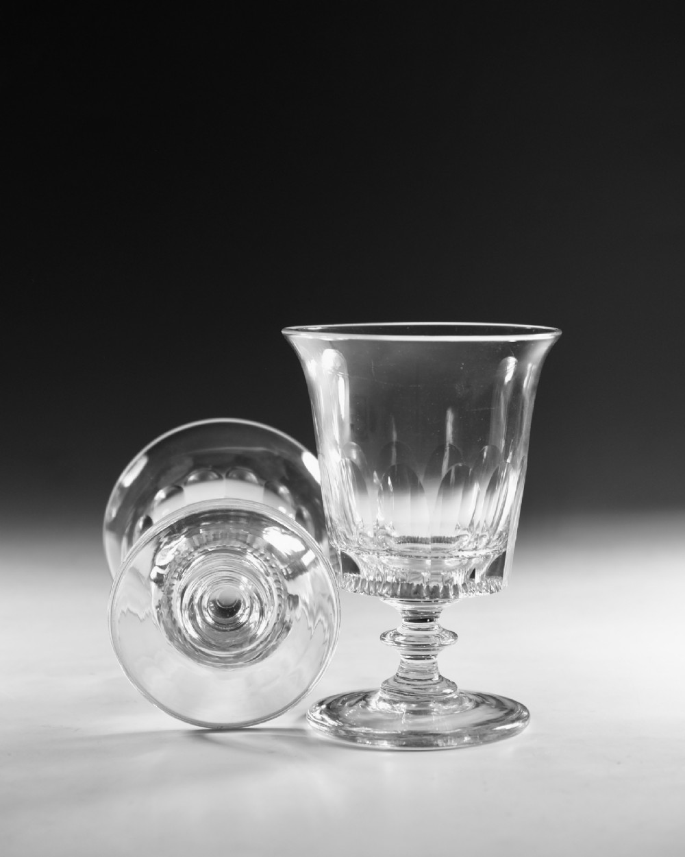 A set of six English Georgian clear glass rummers with cut fluted bowls and knopped stems on circular bases. View VIII