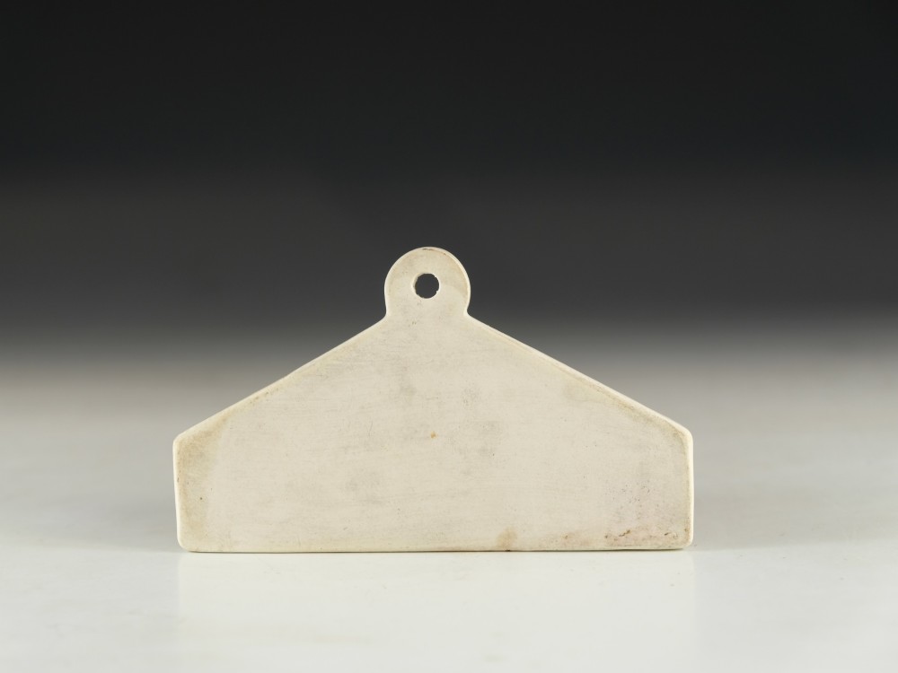 A mid-19th-century white ceramic wine bin label with a top mounting hole, printed with the text MADEIRA in black capital letters. View III