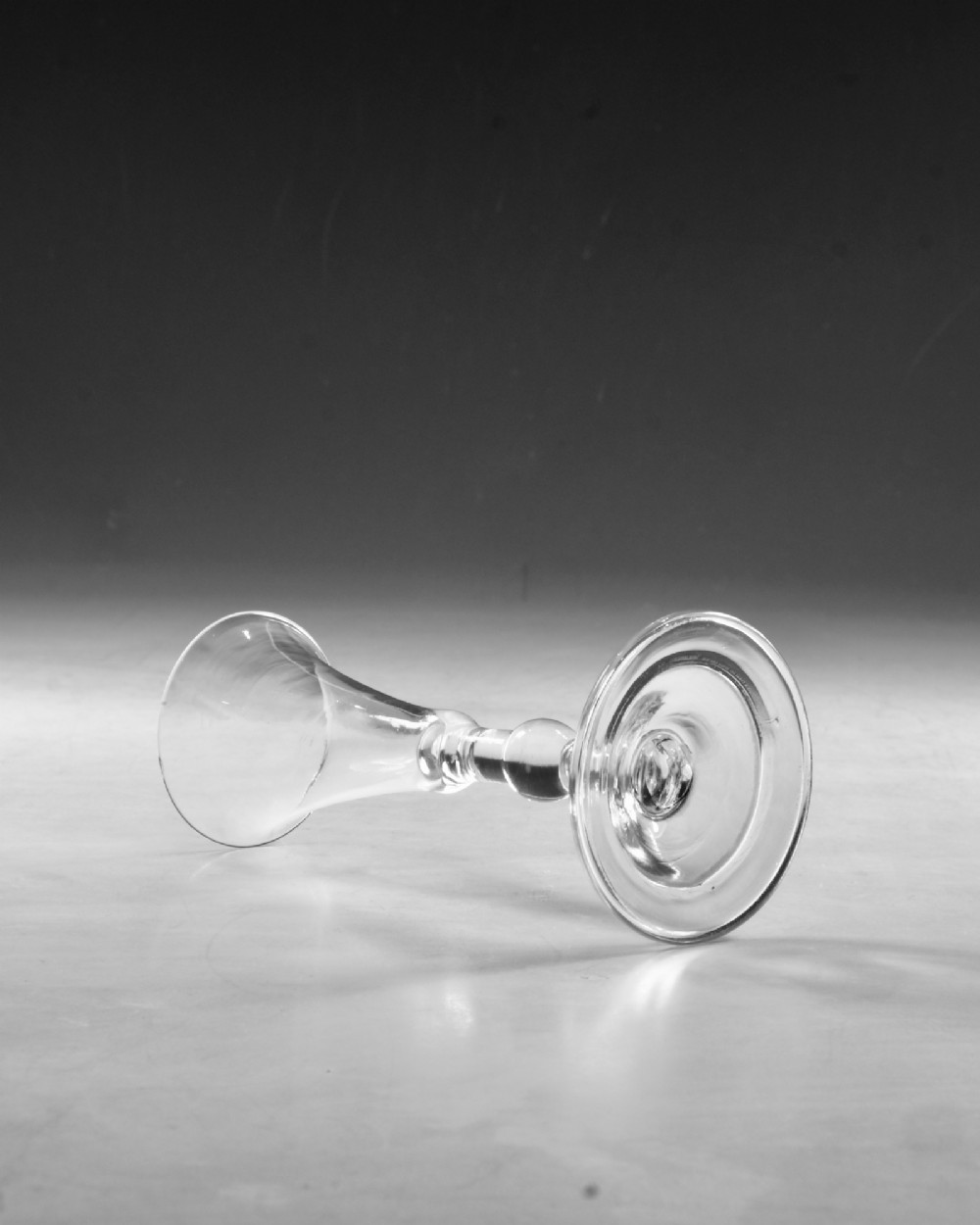 A clear Georgian lead glass vessel featuring a flared trumpet bowl, a central knapped stem, and a circular conical foot. View III