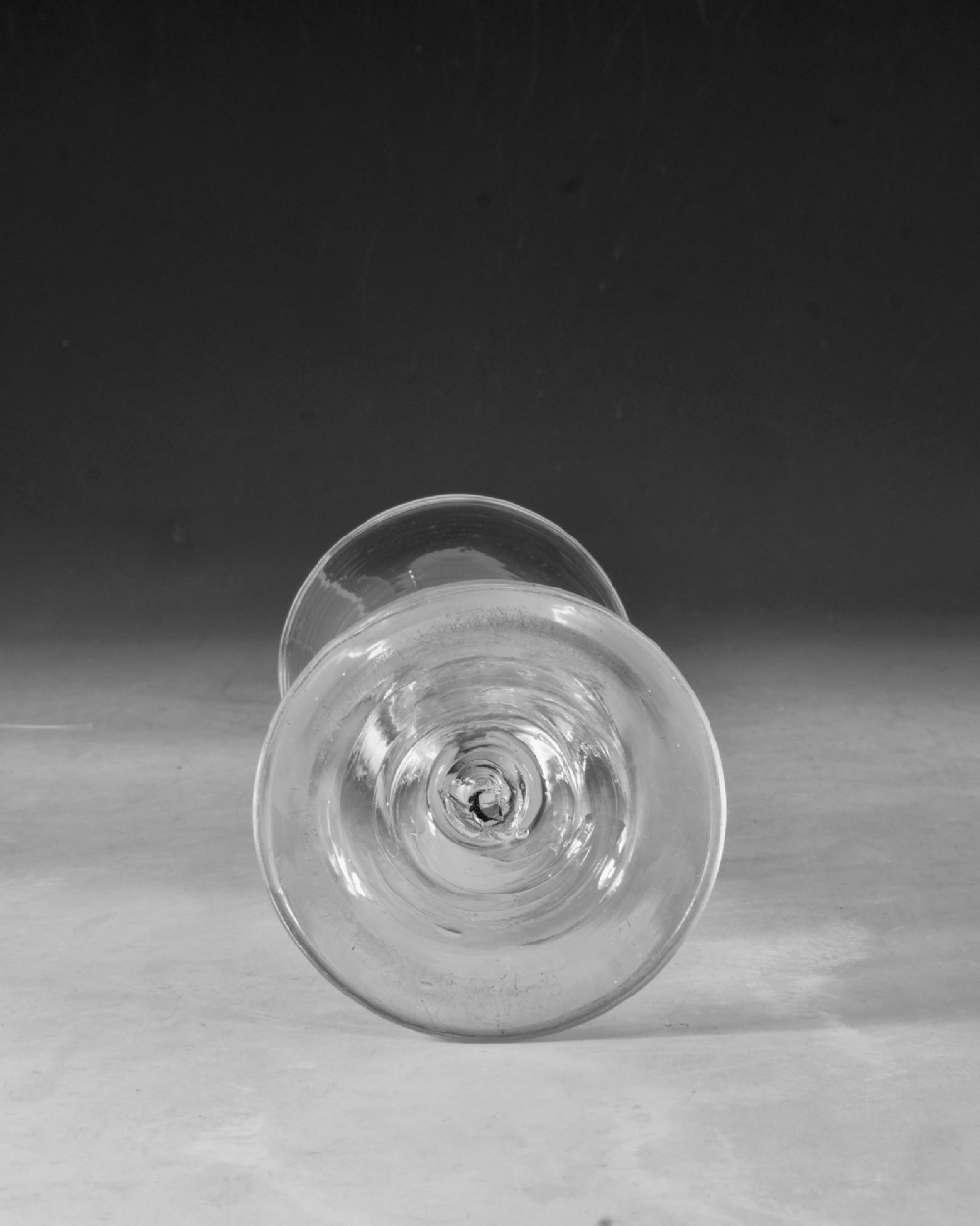A hand-blown clear lead glass baluster wine goblet featuring a bell bowl, knopped stem with an air tear inclusion, and a folded conical foot. View VI