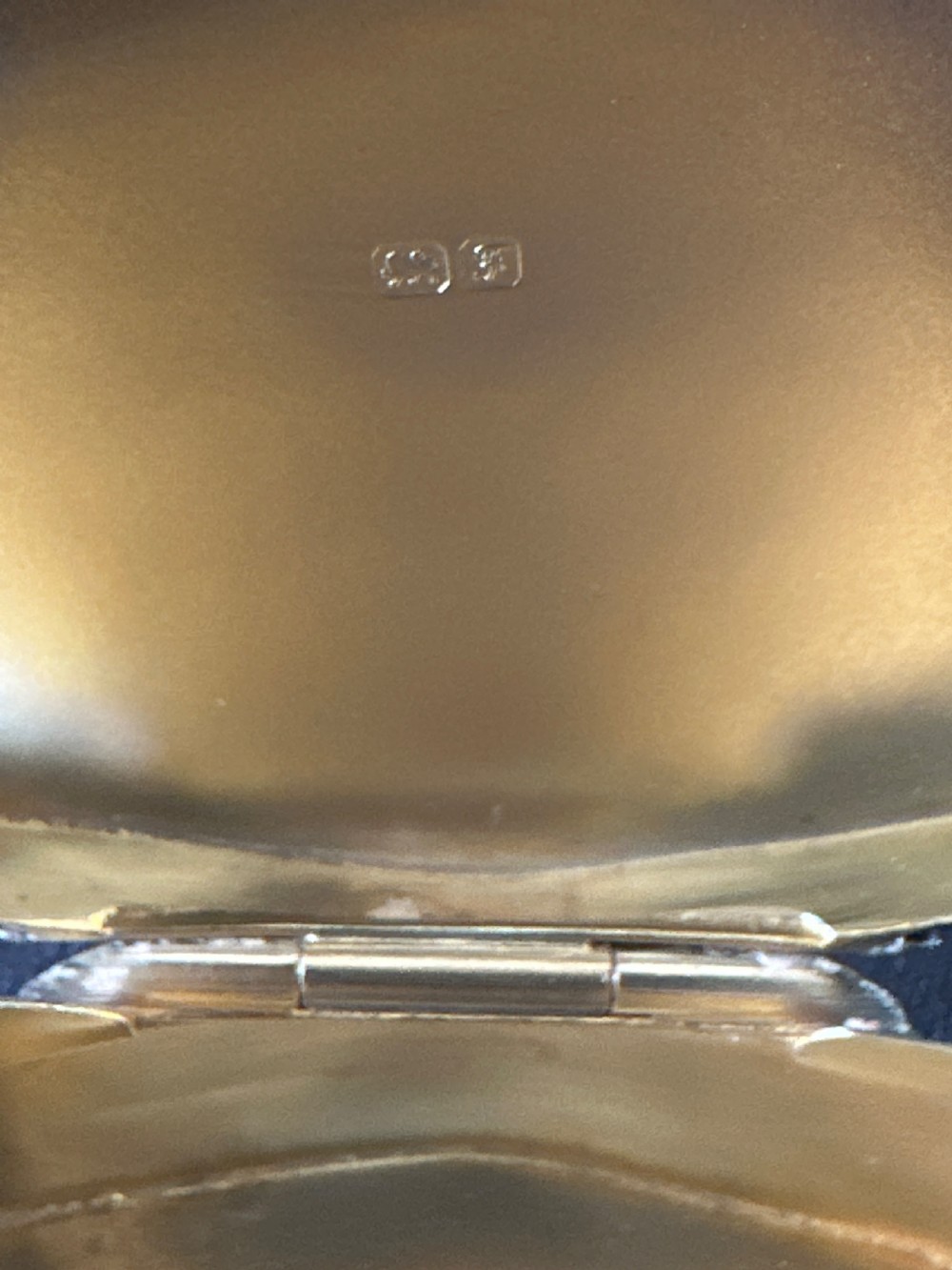 An Edwardian sterling silver shaped box with engine-turned geometric detailing on the lid and a central plain circular cartouche. View IX