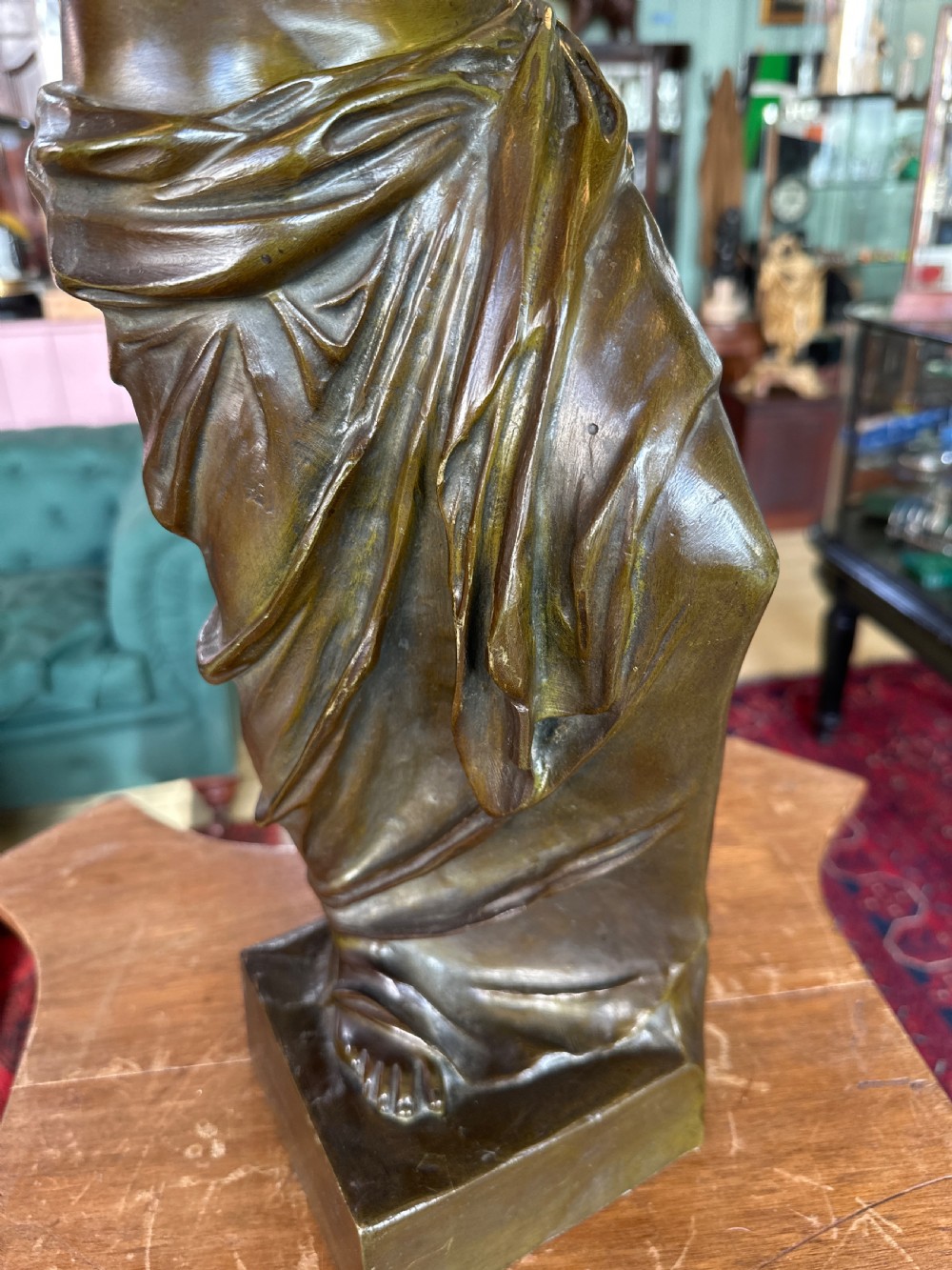 A 19th-century dark brown bronze sculpture depicting the Venus de Milo standing on an integral rectangular base. View VIII