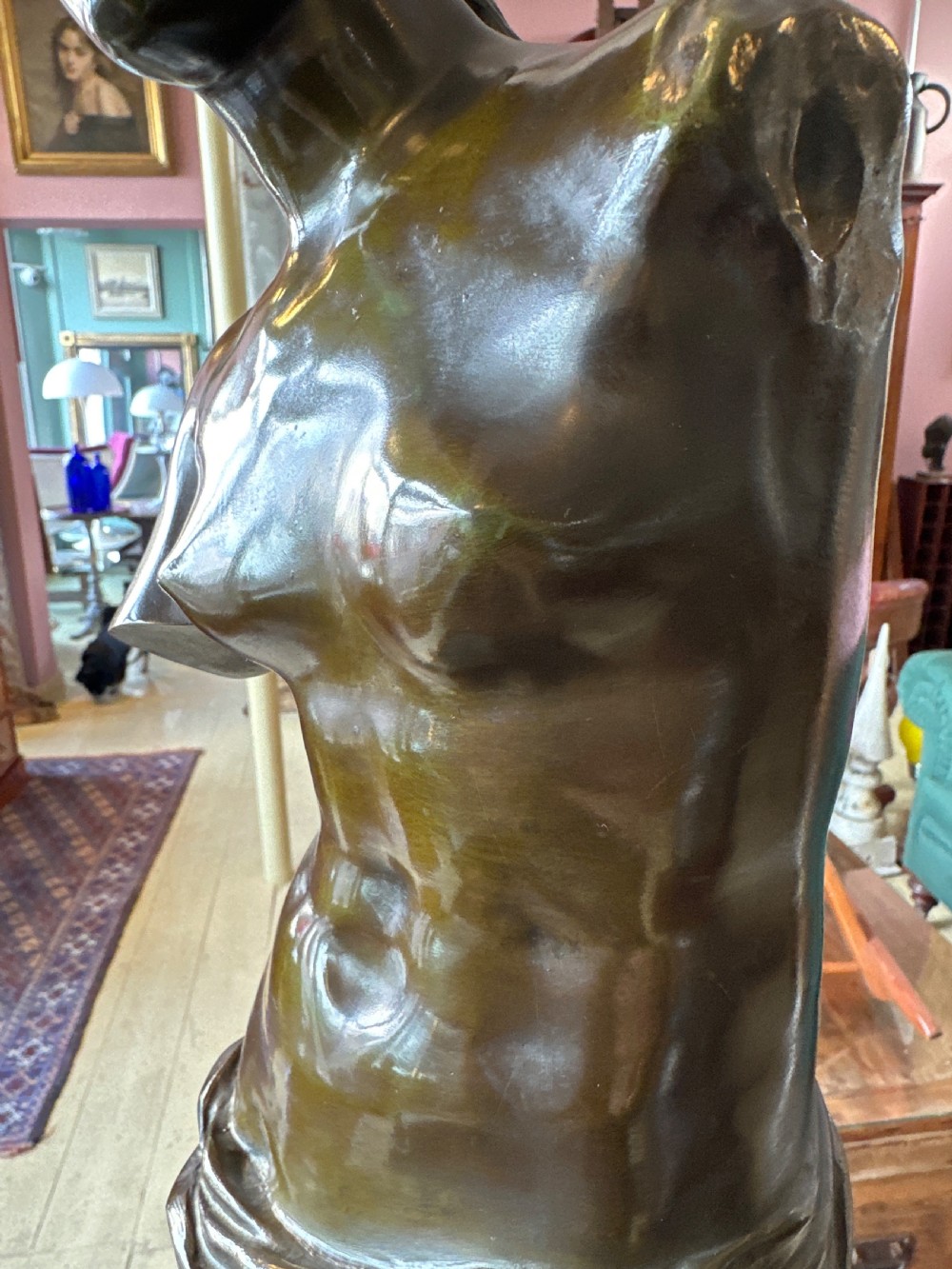 A 19th-century dark brown bronze sculpture depicting the Venus de Milo standing on an integral rectangular base. View XII