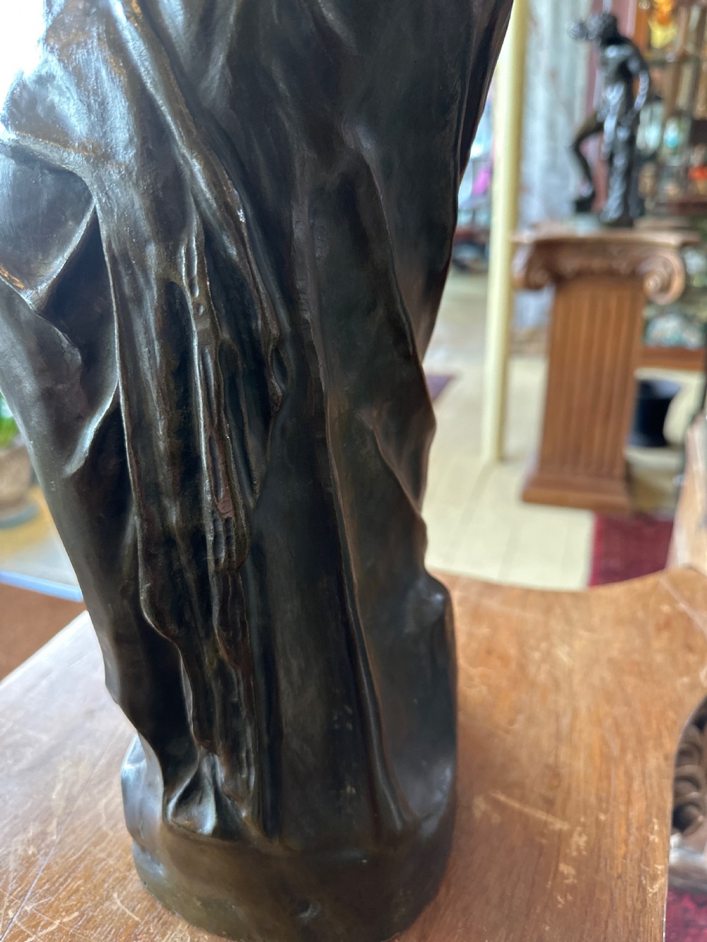 A 19th-century dark brown bronze sculpture depicting the Venus de Milo standing on an integral rectangular base. View XIII