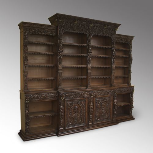A Magnificent Carved Oak Renaissance-style Breakfront Open Bookcase