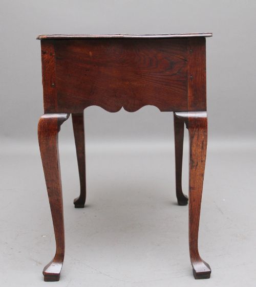 A DECORATIVE 18TH CENTURY OAK LOWBOY - ADDITIONAL PHOTO 6