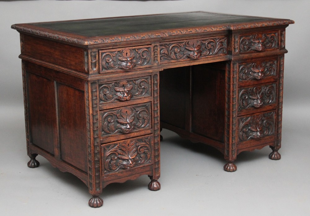 Carved oak pedestal desk