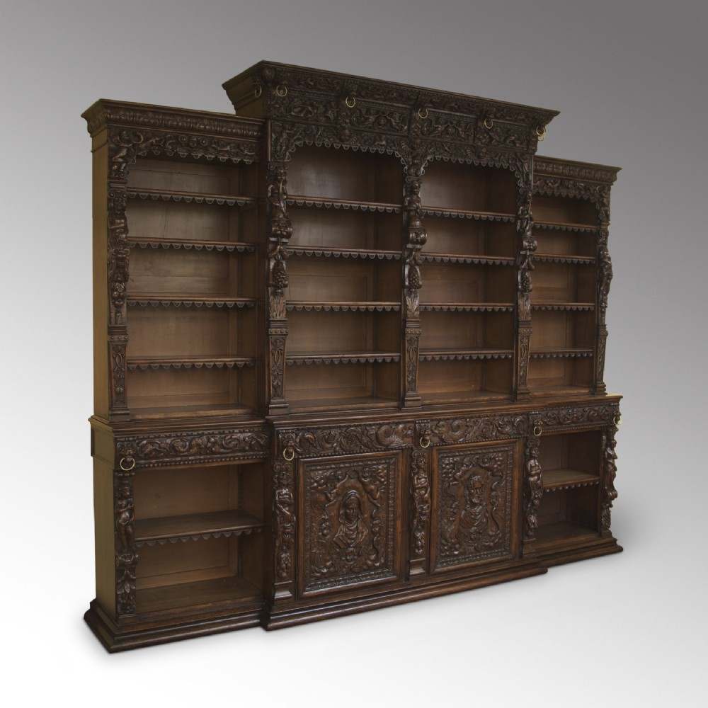 A Magnificent Carved Oak Renaissance-style Breakfront Open Bookcase