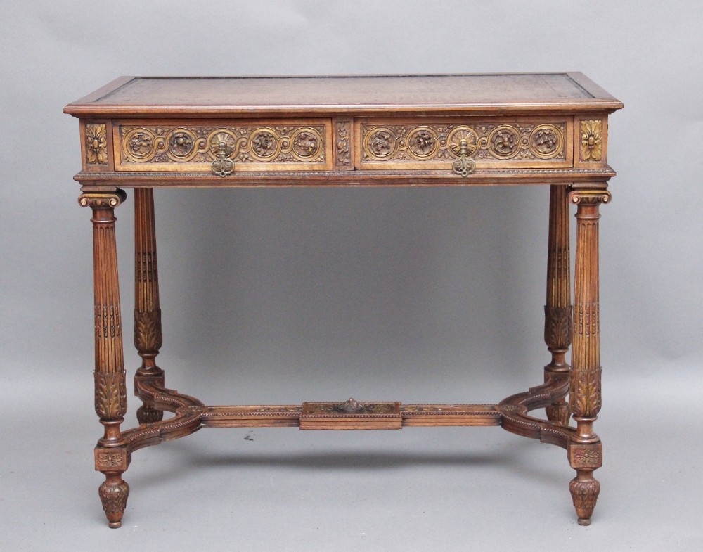 Carved walnut writing table