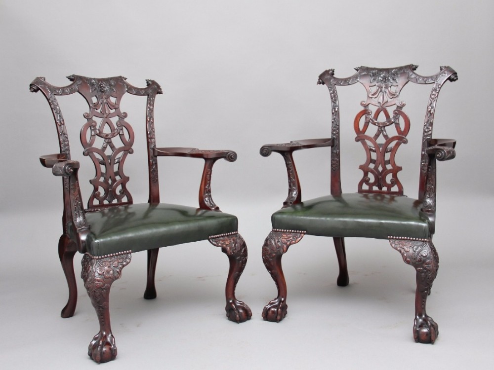 A pair of 19th Century Chippendale armchairs