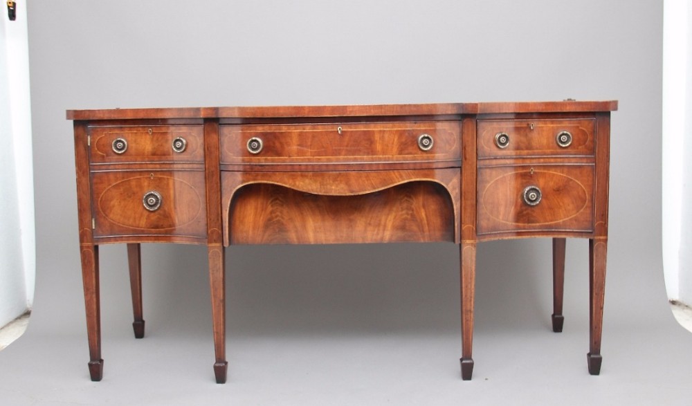 19th Century mahogany serpentine sideboard