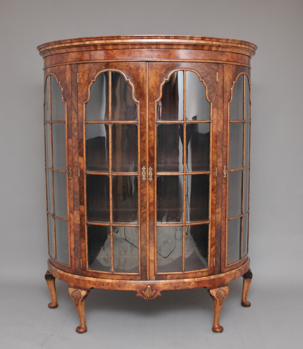 Early 20th Century walnut bowfronted display cabinet