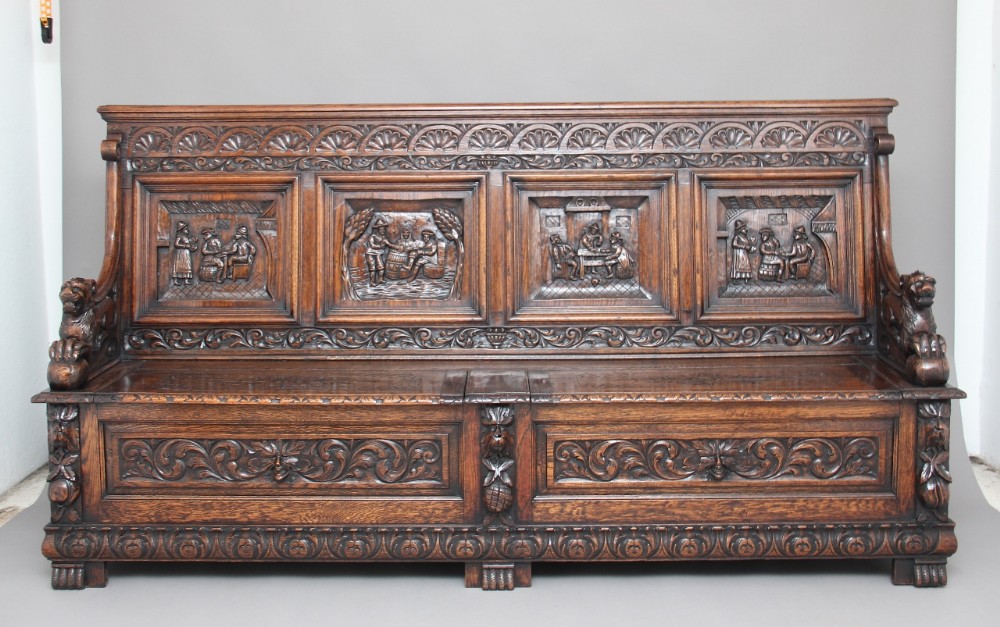 Large 19th Century carved oak box settle