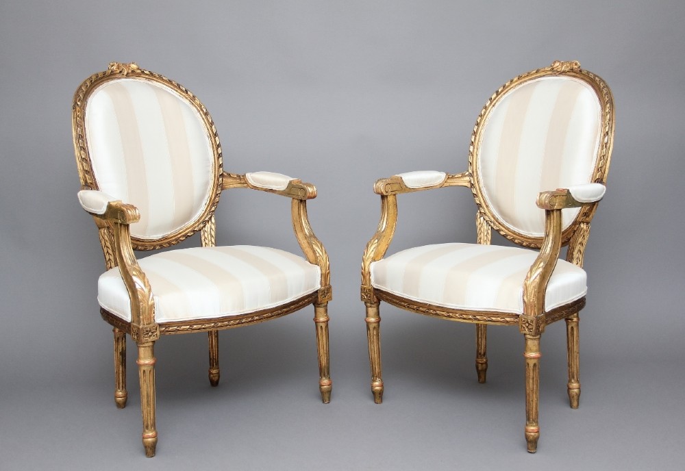 Pair of 19th Century giltwood and carved armchairs