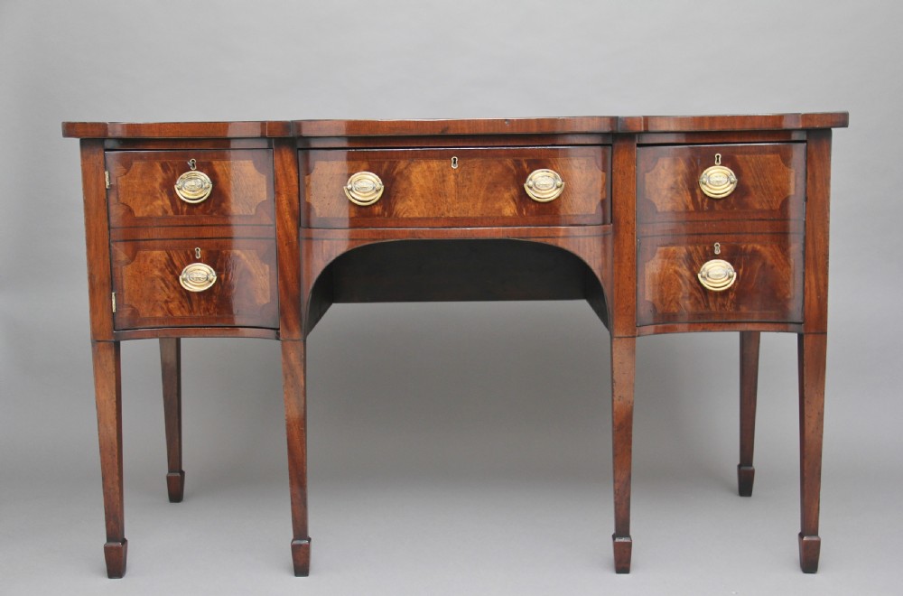 19th Century mahogany serpentine sideboard