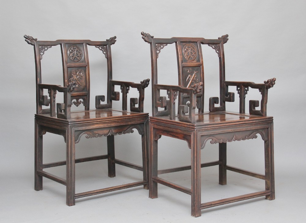A pair of mid 19th Century carved Chinese armchairs