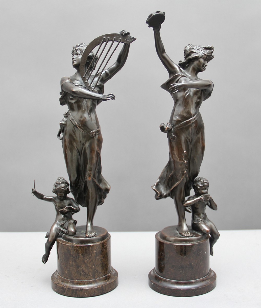 A pair of 19th Century classical bronze figures