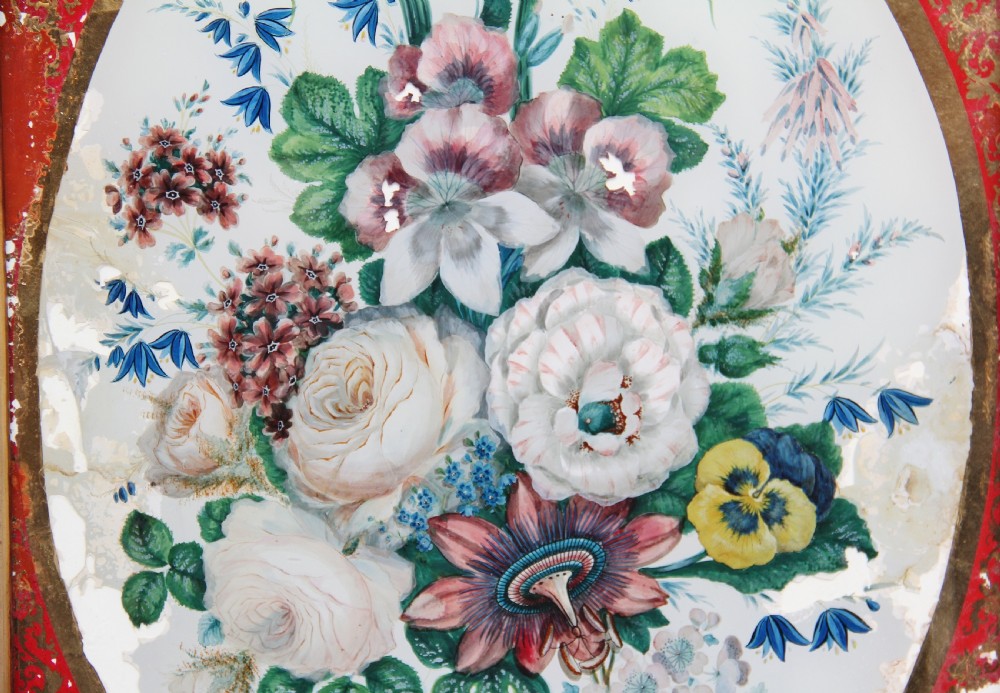 A pair of early 19th-century framed botanical paintings depicting colourful floral bouquets within oval apertures surrounded by red and gold patterned borders. View VII