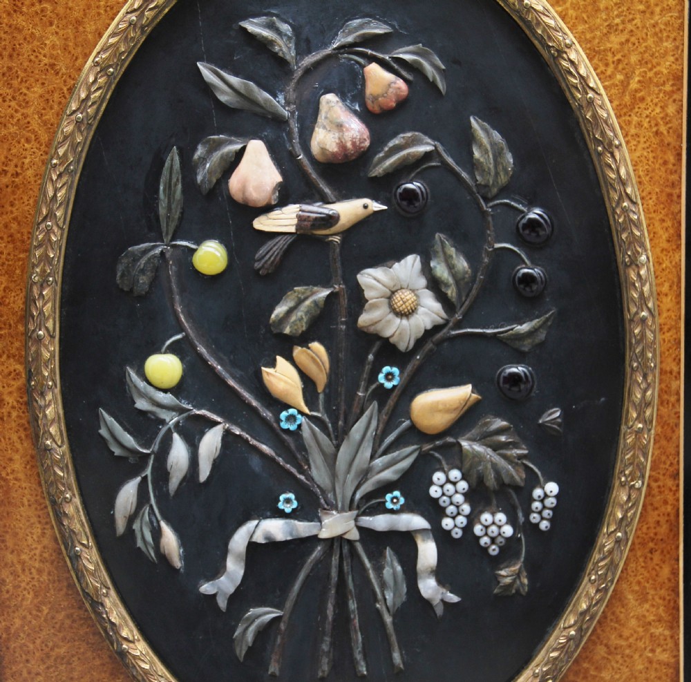 A 19th-century ebonised and amboyna wood credenza featuring central doors with oval pietre dure panels, porcelain medallion inserts, gilt bronze mounts, and curved glass side compartments. View XI