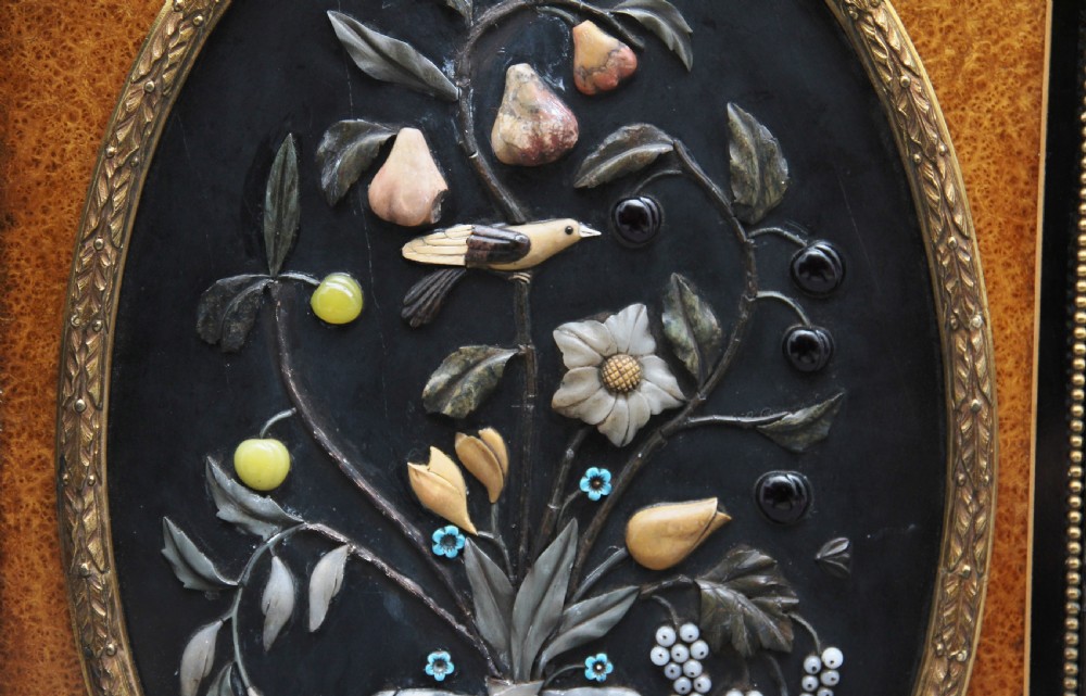 A 19th-century ebonised and amboyna wood credenza featuring central doors with oval pietre dure panels, porcelain medallion inserts, gilt bronze mounts, and curved glass side compartments. View XII