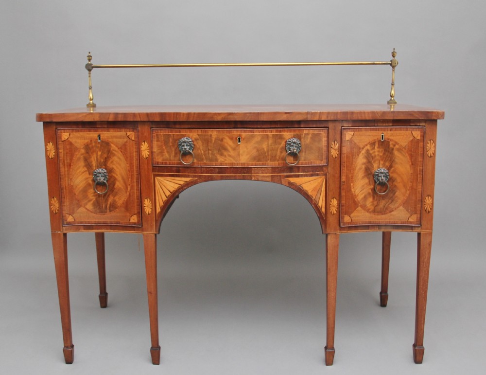 Early 19th Century mahogany inlaid serpentine sideboard