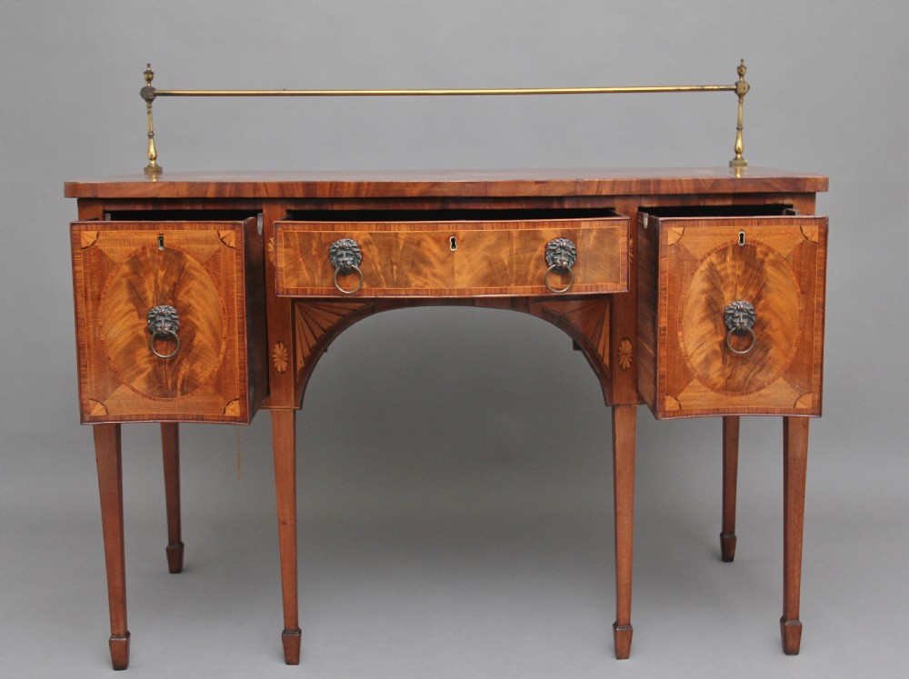 Early 19th Century mahogany inlaid serpentine sideboard View II
