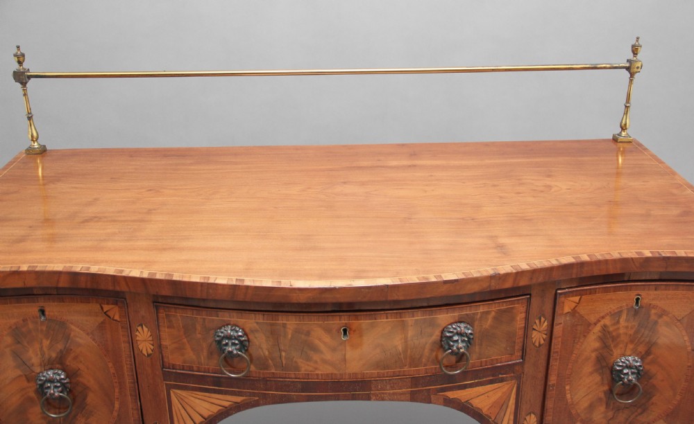 Early 19th Century mahogany inlaid serpentine sideboard View XIII