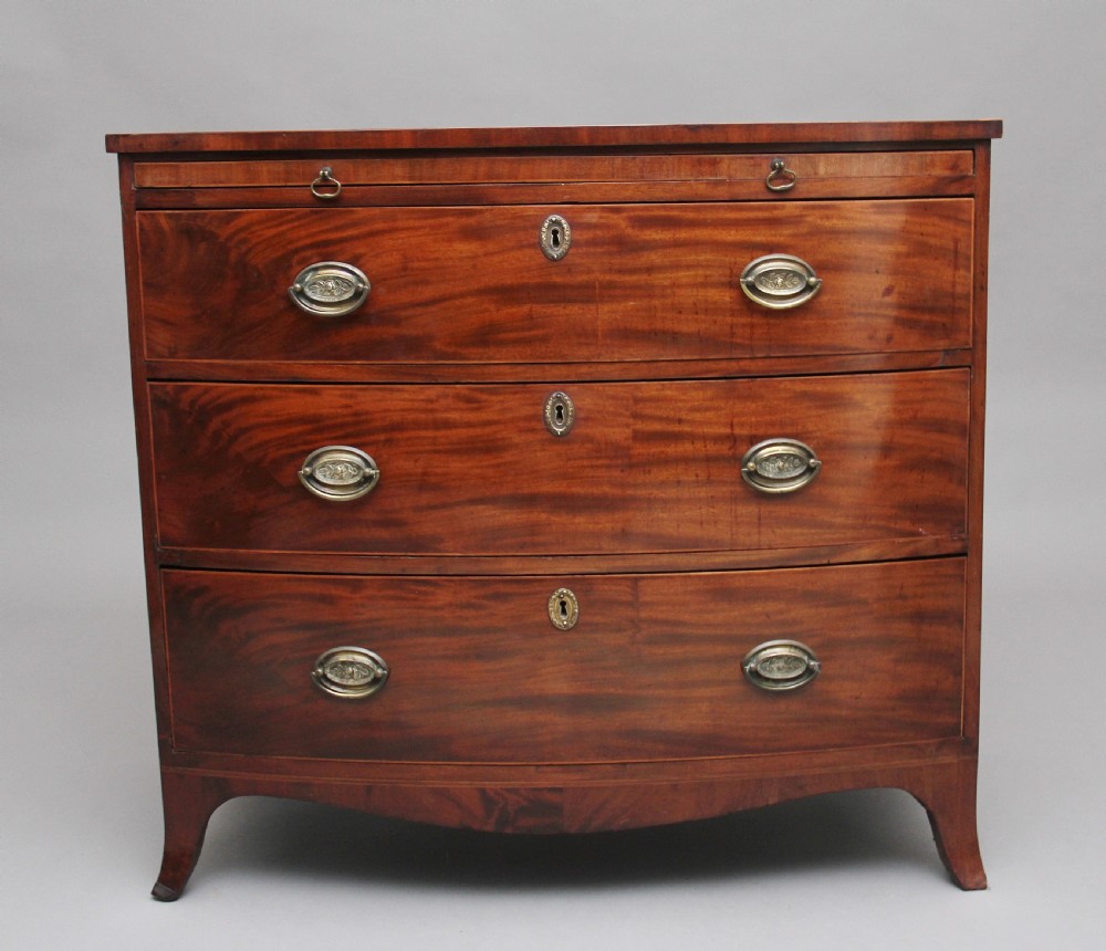 Early 19th Century mahogany bowfront chest with slide