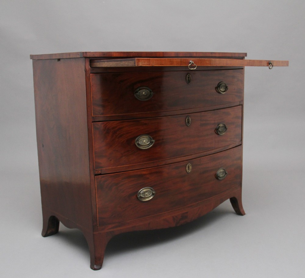 Early 19th Century mahogany bowfront chest with slide View III