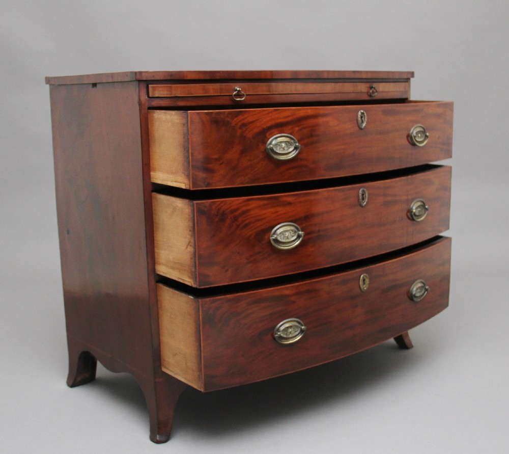 Early 19th Century mahogany bowfront chest with slide View IV