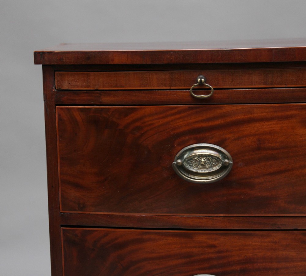 Early 19th Century mahogany bowfront chest with slide View X