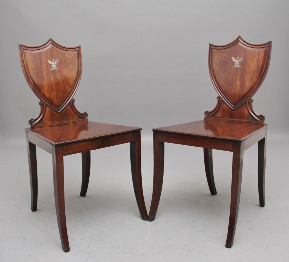Pair of early 19th Century mahogany hall chairs