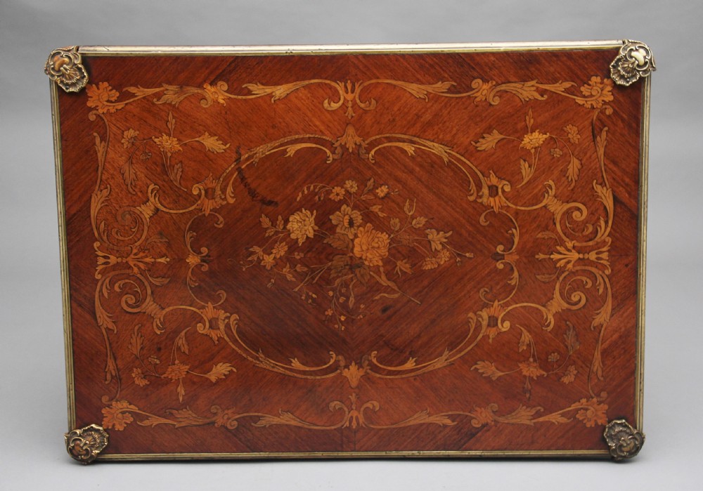 A 19th-century French Rococo revival kingwood fold-over card table with floral marquetry inlay, cabriole legs, and ornate gilt ormolu mounts. View VIII