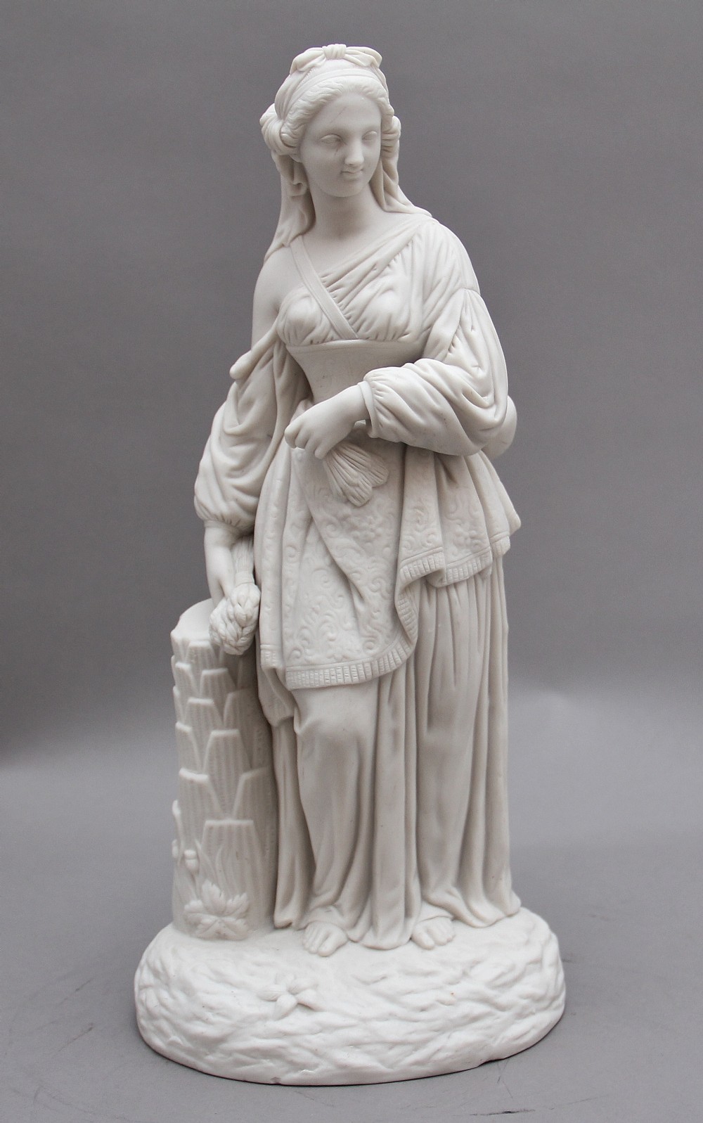 19th Century parian figure of a lady leaning on a column