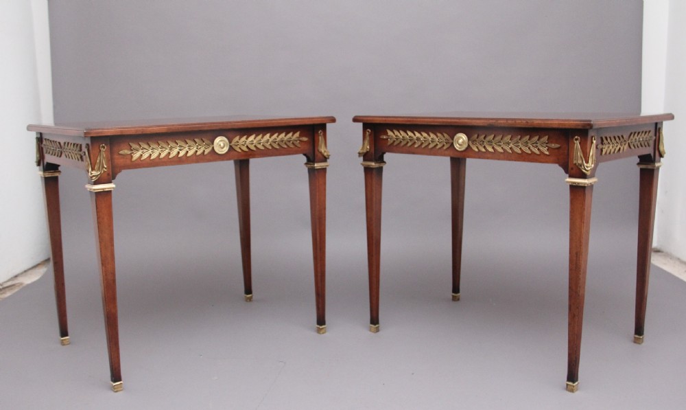 Pair of French mahogany and brass mounted lamp tables