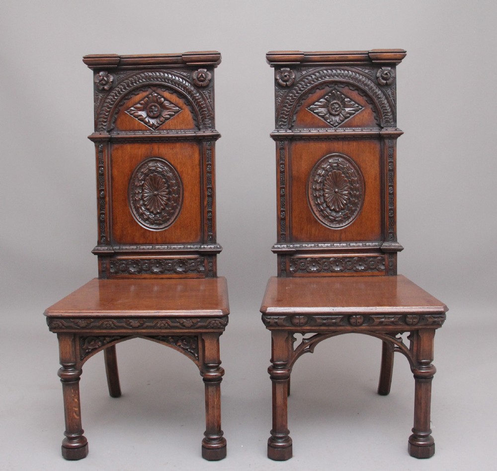 Near pair of 19th Century carved oak Gothic hall chairs View II