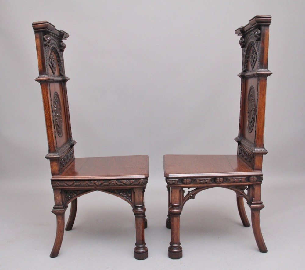 Near pair of 19th Century carved oak Gothic hall chairs View III