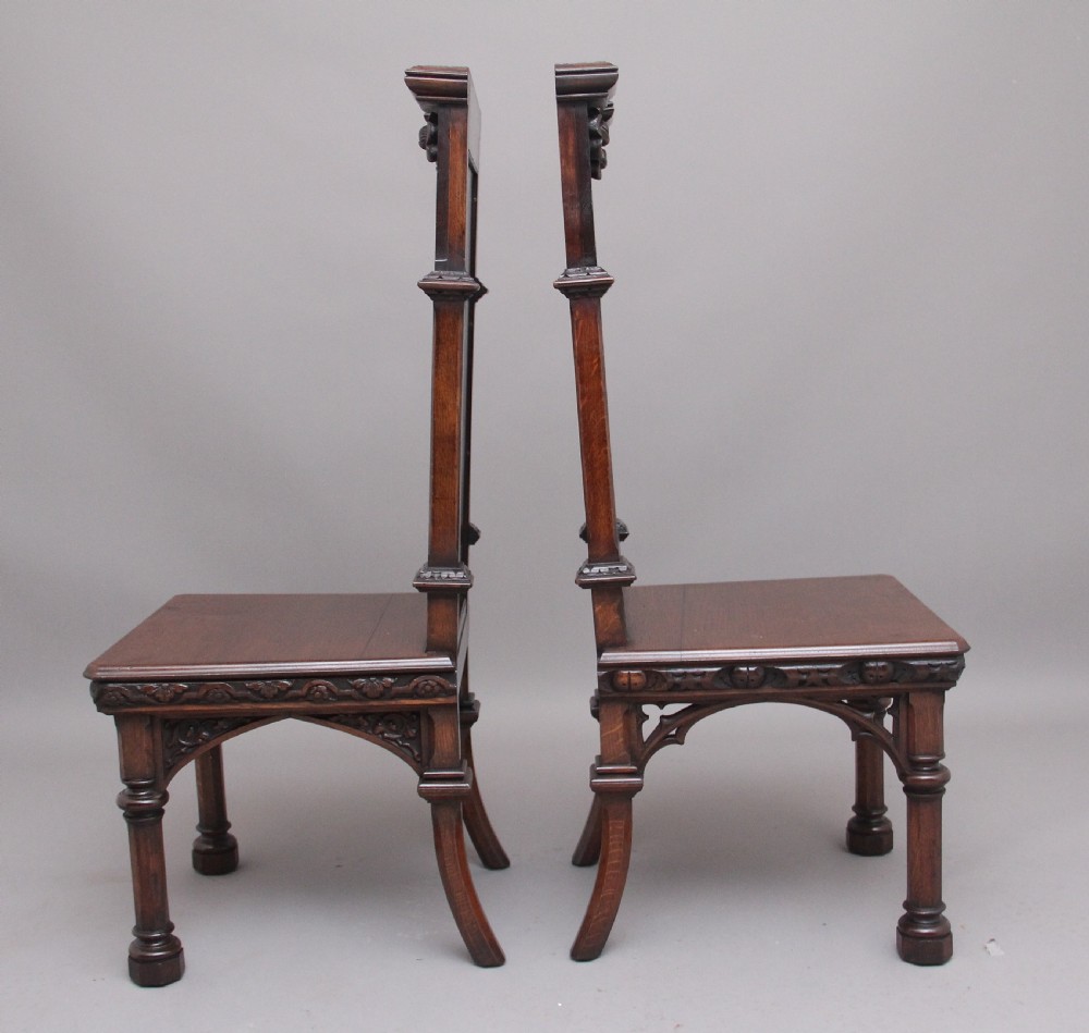Near pair of 19th Century carved oak Gothic hall chairs View V