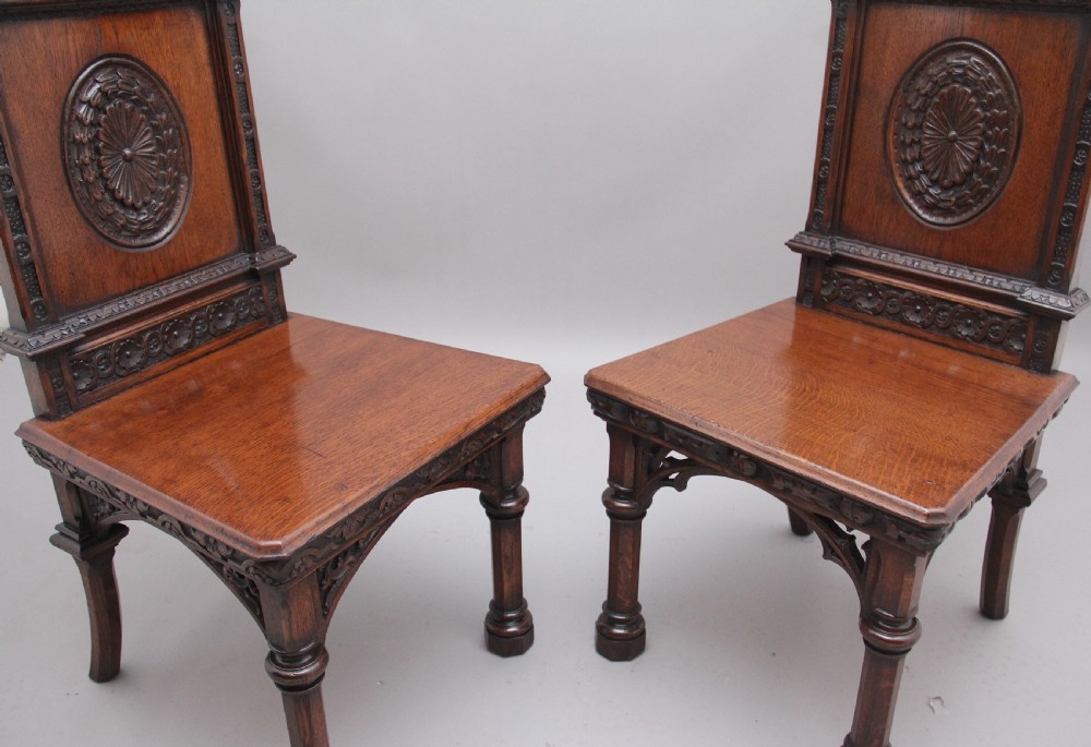 Near pair of 19th Century carved oak Gothic hall chairs View VIII