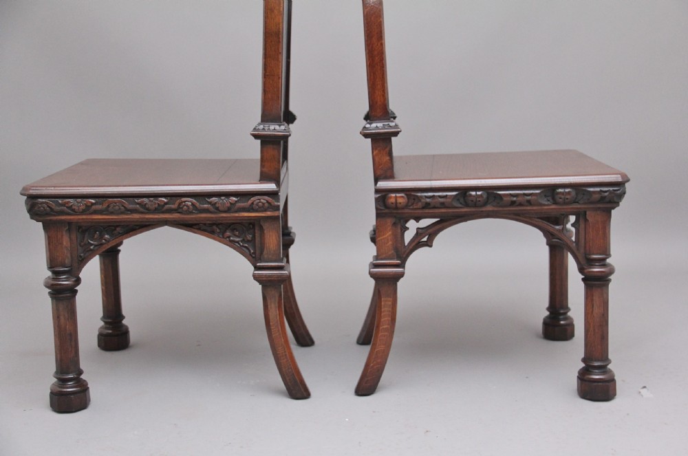 Near pair of 19th Century carved oak Gothic hall chairs View X
