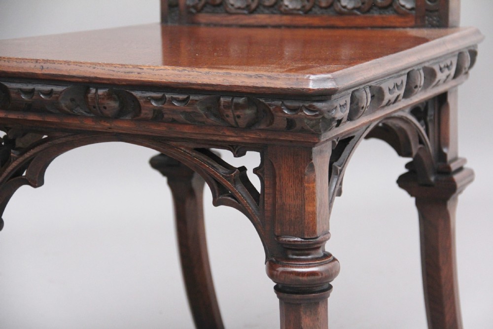 Near pair of 19th Century carved oak Gothic hall chairs View XI