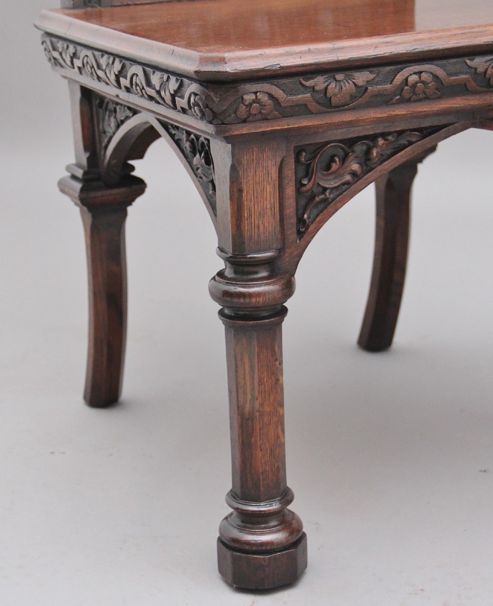 Near pair of 19th Century carved oak Gothic hall chairs View XII