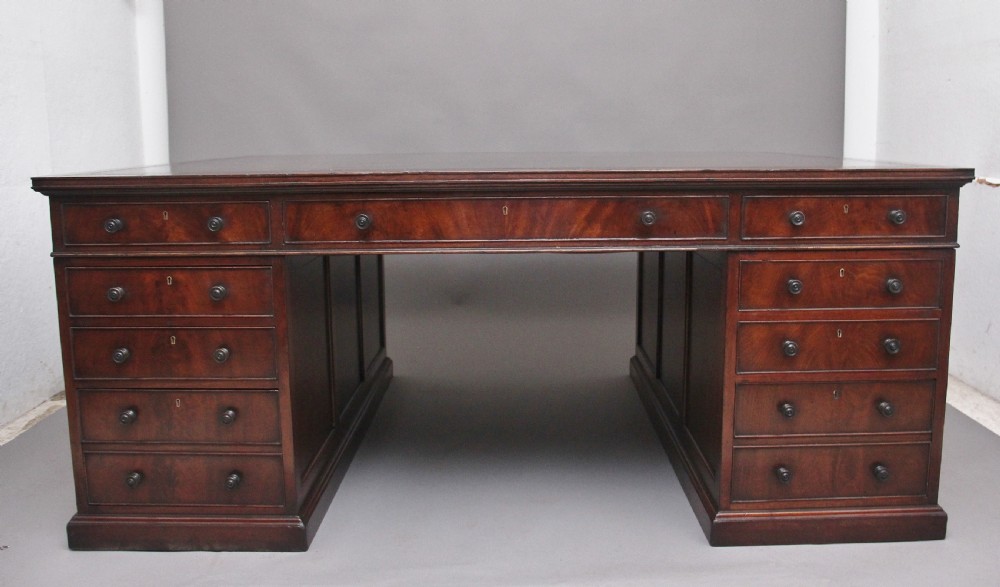 A large and impressive early 20th Century mahogany partners desk