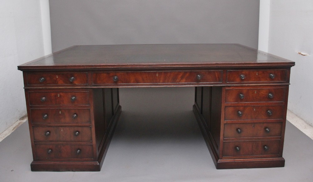 A large and impressive early 20th Century mahogany partners desk View II