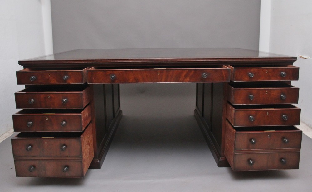 A large and impressive early 20th Century mahogany partners desk View III