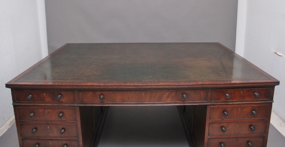 A large and impressive early 20th Century mahogany partners desk View IV