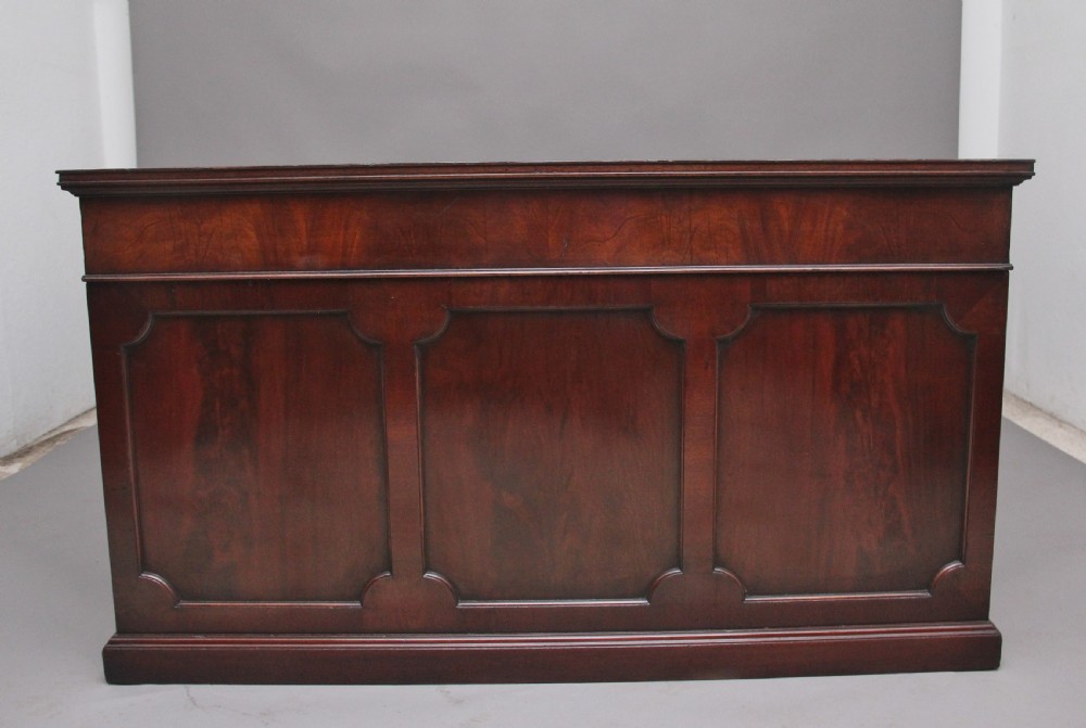 A large and impressive early 20th Century mahogany partners desk View V