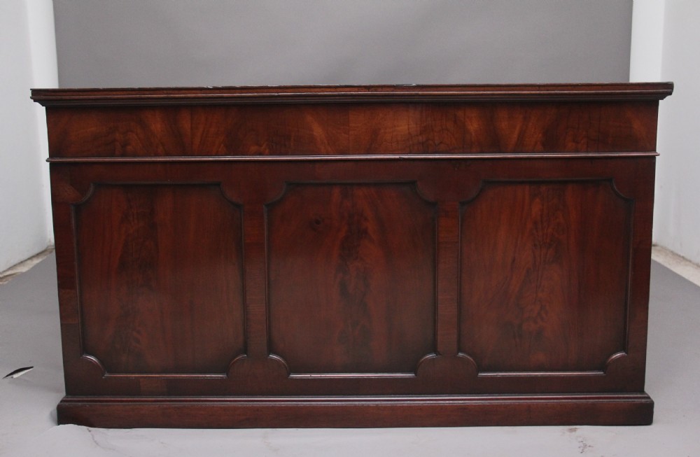 A large and impressive early 20th Century mahogany partners desk View VIII