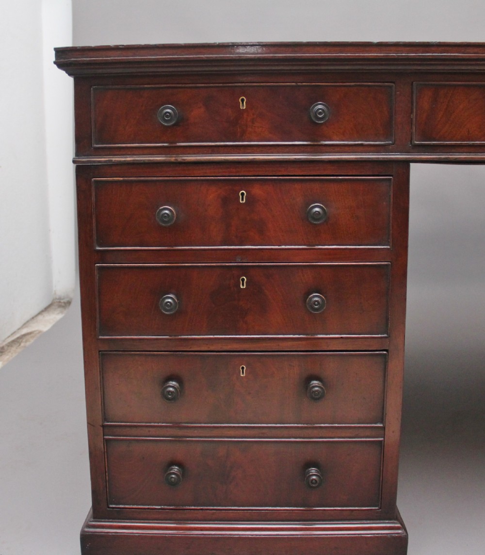 A large and impressive early 20th Century mahogany partners desk View XI
