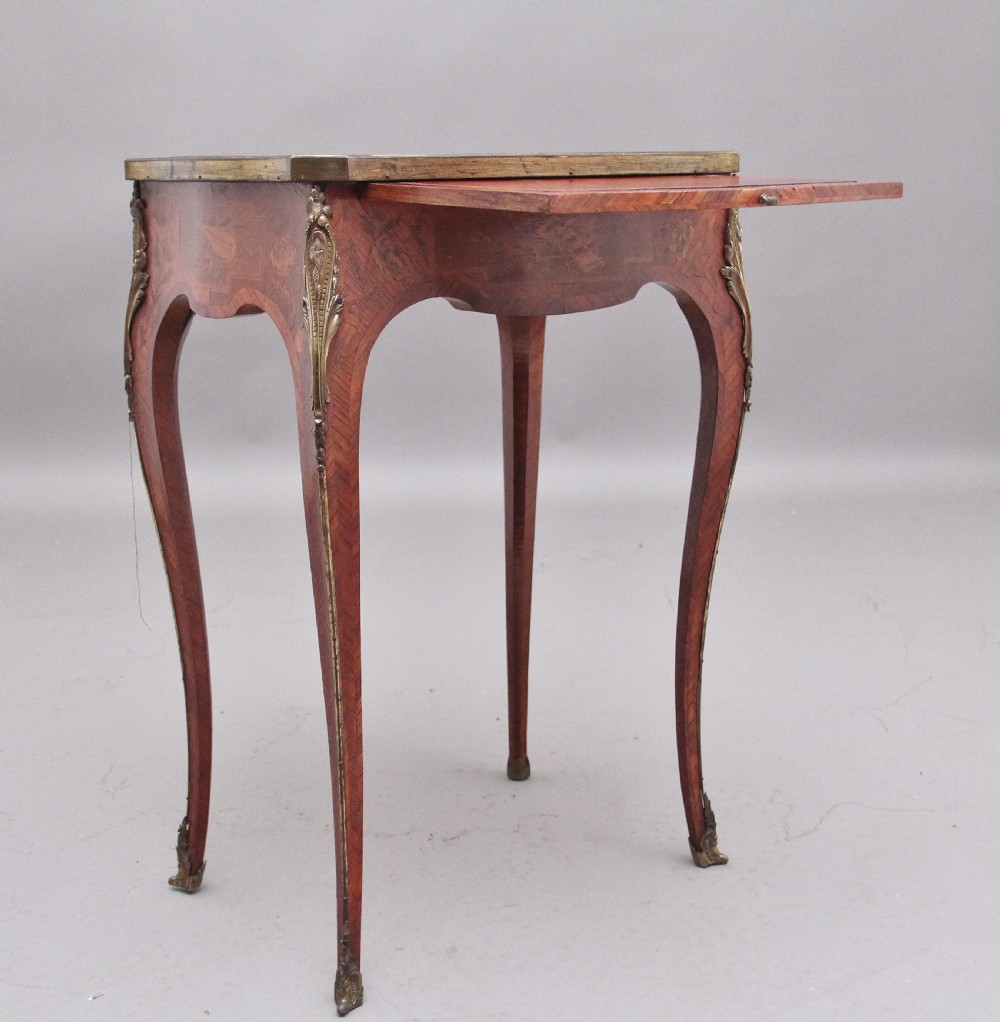 An early 20th-century French kingwood side table featuring slender cabriole legs, floral marquetry inlay, and gilt-metal mounts. View II